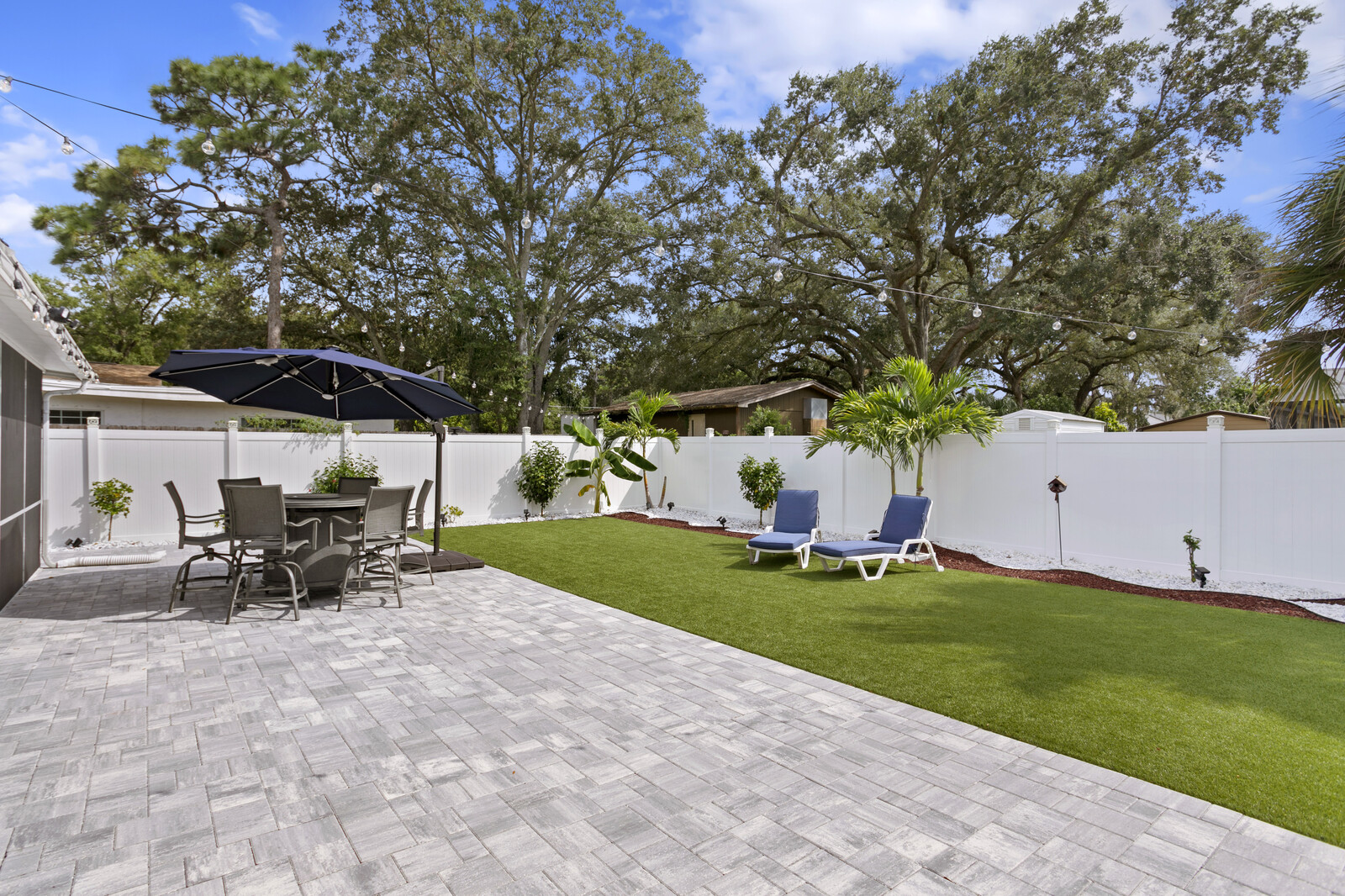 Beautifully Landscaped Backyard with Artificial Turf in Seminole Heights