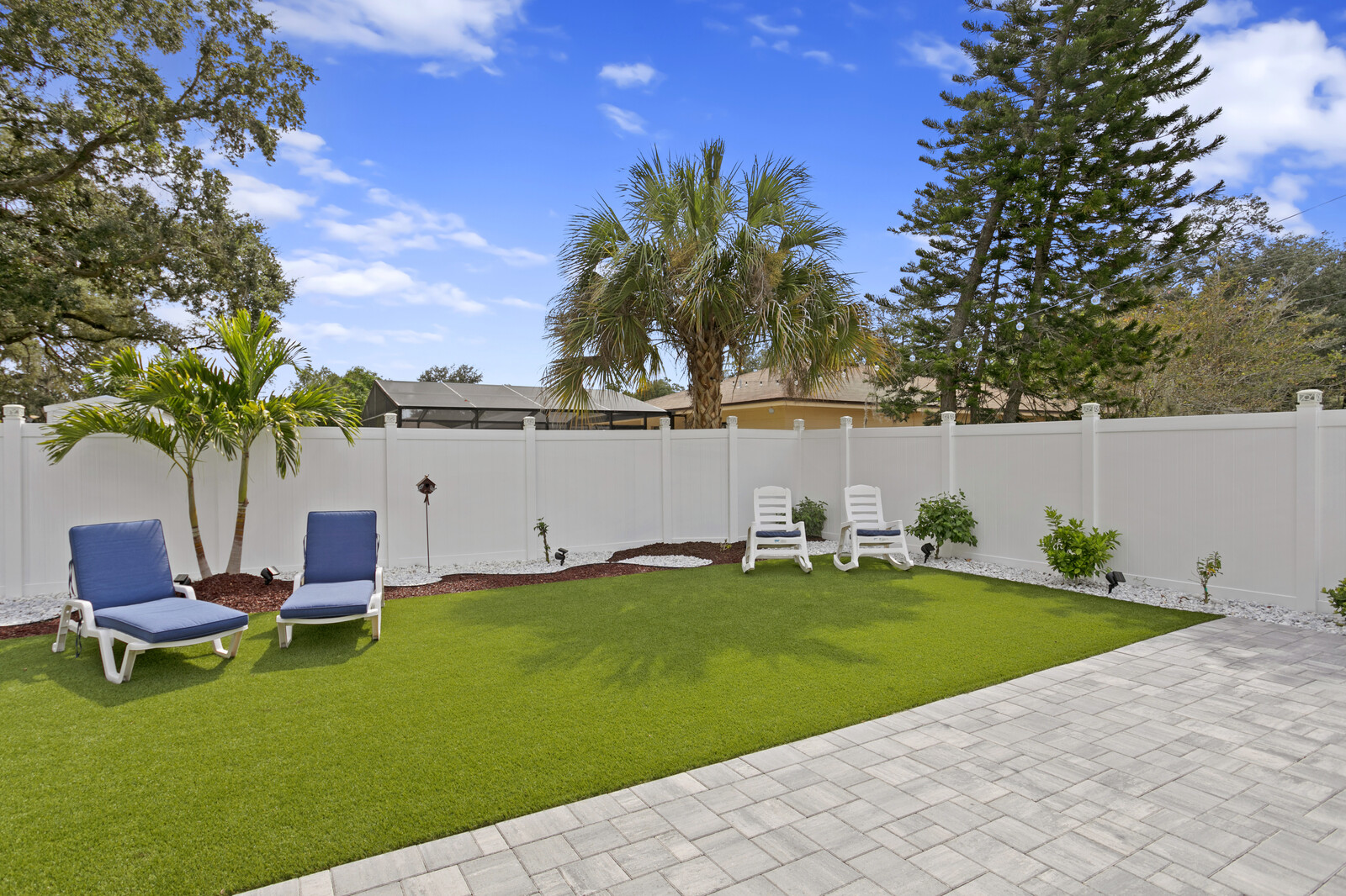 Pavers create a siting area in South Seminole Heights Home 608 Emma by Fadal Real Estate Tampa